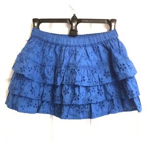 Ladies mini skirt with eyelet tiered layers.